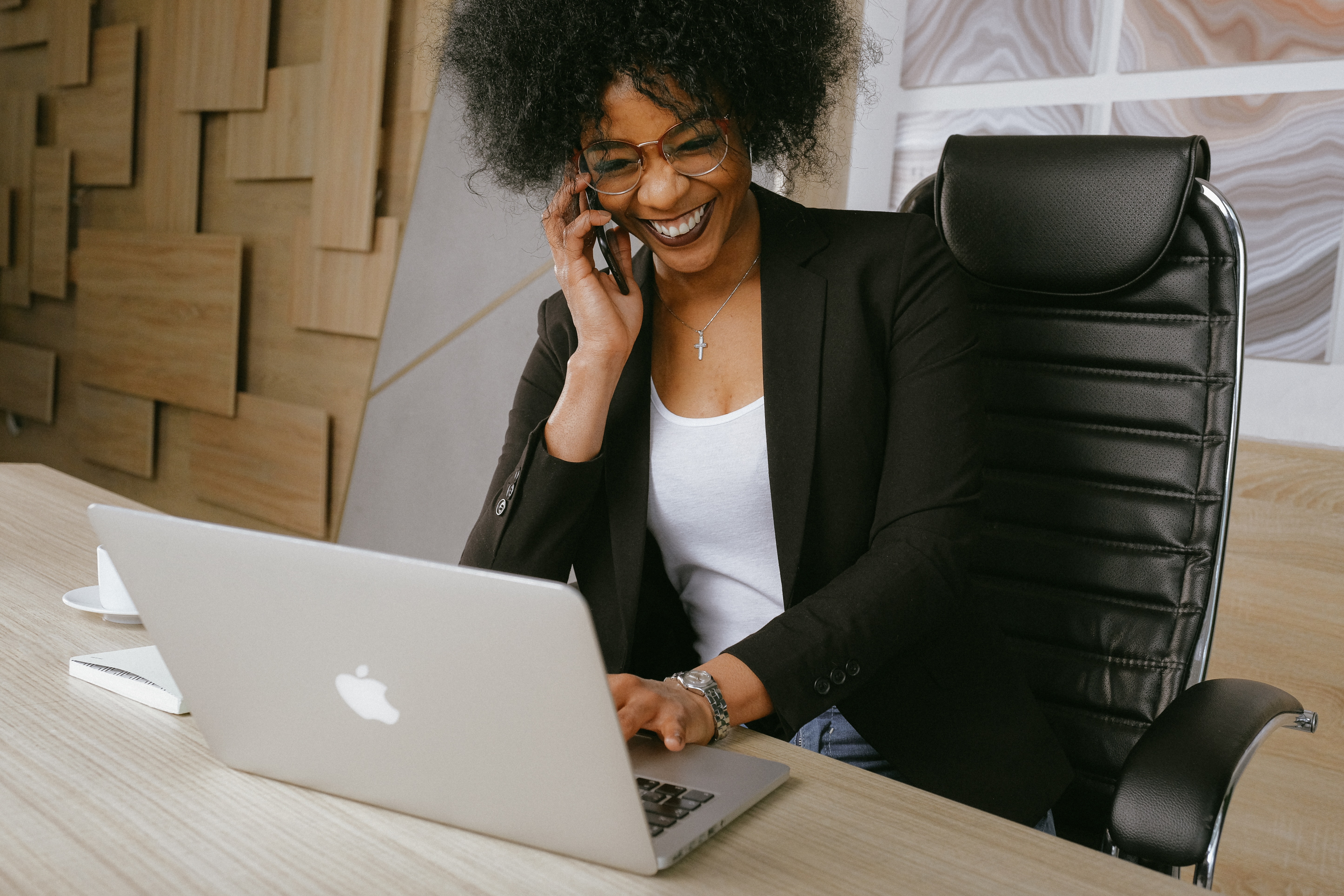 woman talking on phone at desk